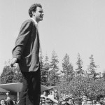 Mario Savio (in socks) speaking from top of police car by Steven Marcus